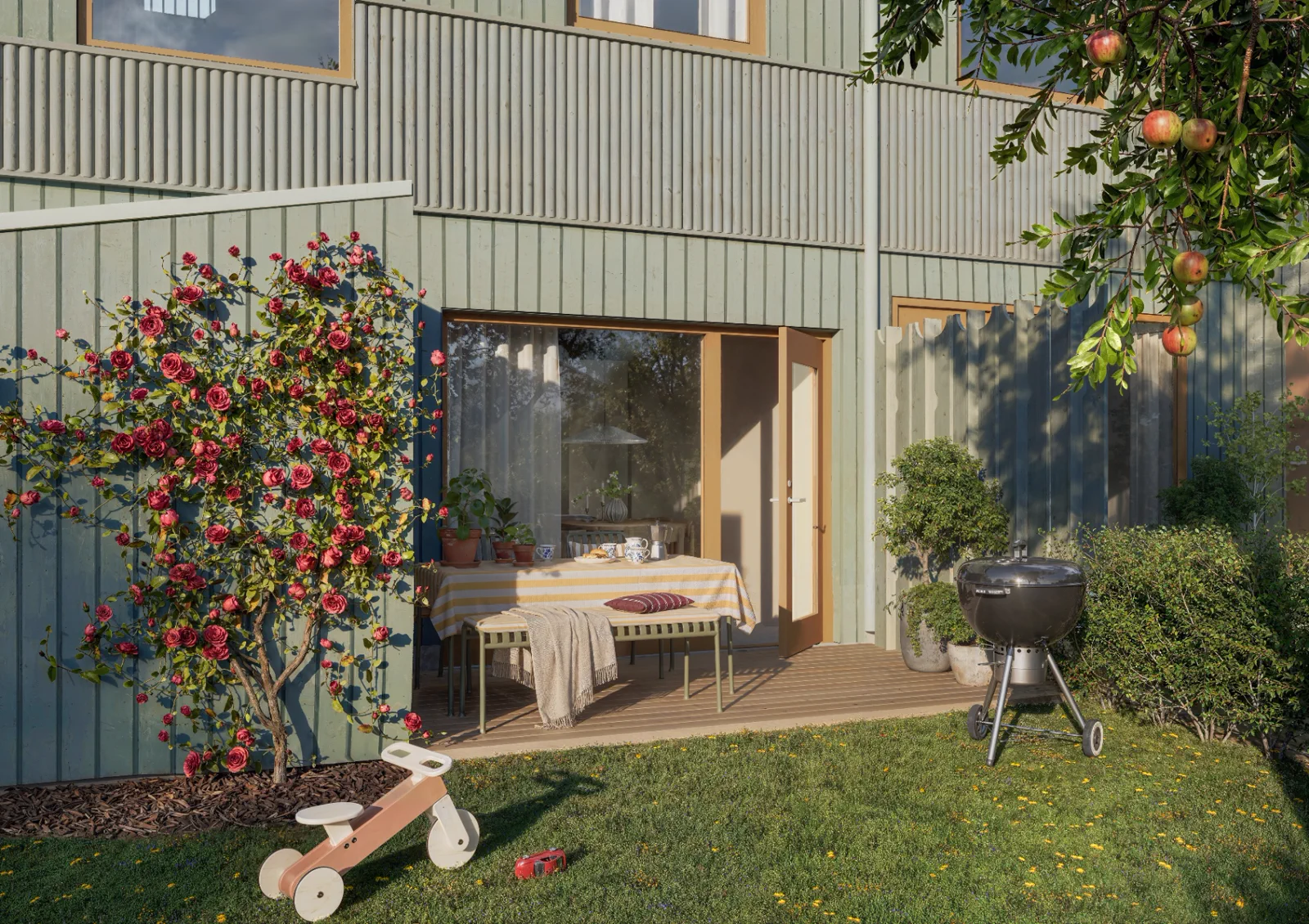 Solbänkens privata trädgård med uteplats och blommande växter